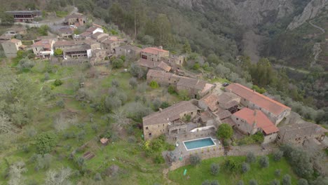 Aerial-orbit-over-the-Casal-de-São-Simão---a-unique-architectural-heritage-landscape-hidden-in-Central-Portugal-mountains