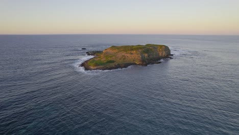 cook island in the middle of the ocean in nsw, australia - aerial shot