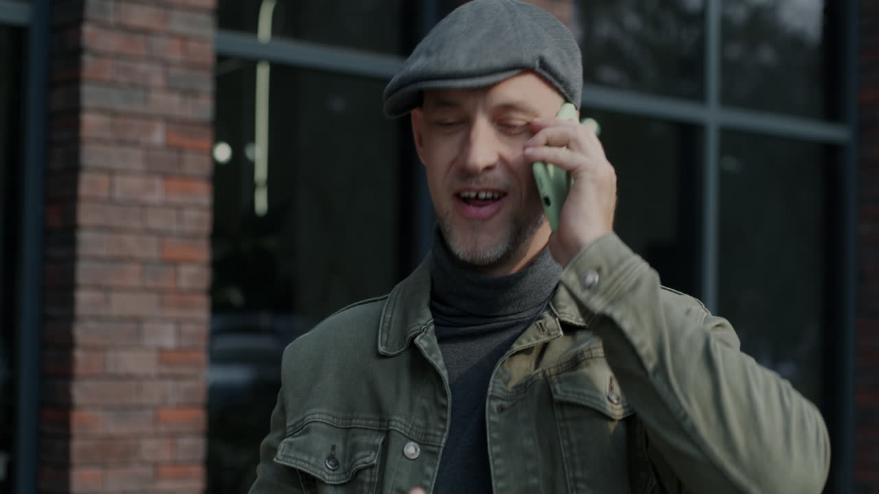 Man talking on his phone outside