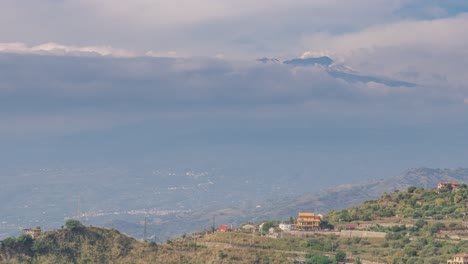 Aerial-time-lapse-just-above-the-clouds-of-the-Volcanic-Mount-Etna-Venting-Steam-and-Smoke