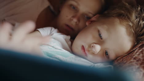 mother and son with pad before bedtime