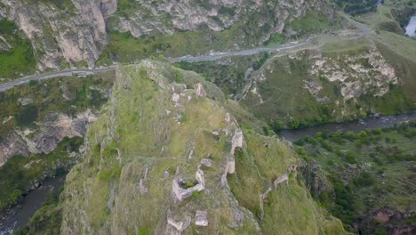 Tmogvi-is-a-ruined-fortress-in-the-southern-Georgian-region-of-Samtskhe-Javakheti,-on-the-left-bank-of-the-Kura-River,-a-few-kilometers-downstream-of-the-cave-city-of-Vardzia