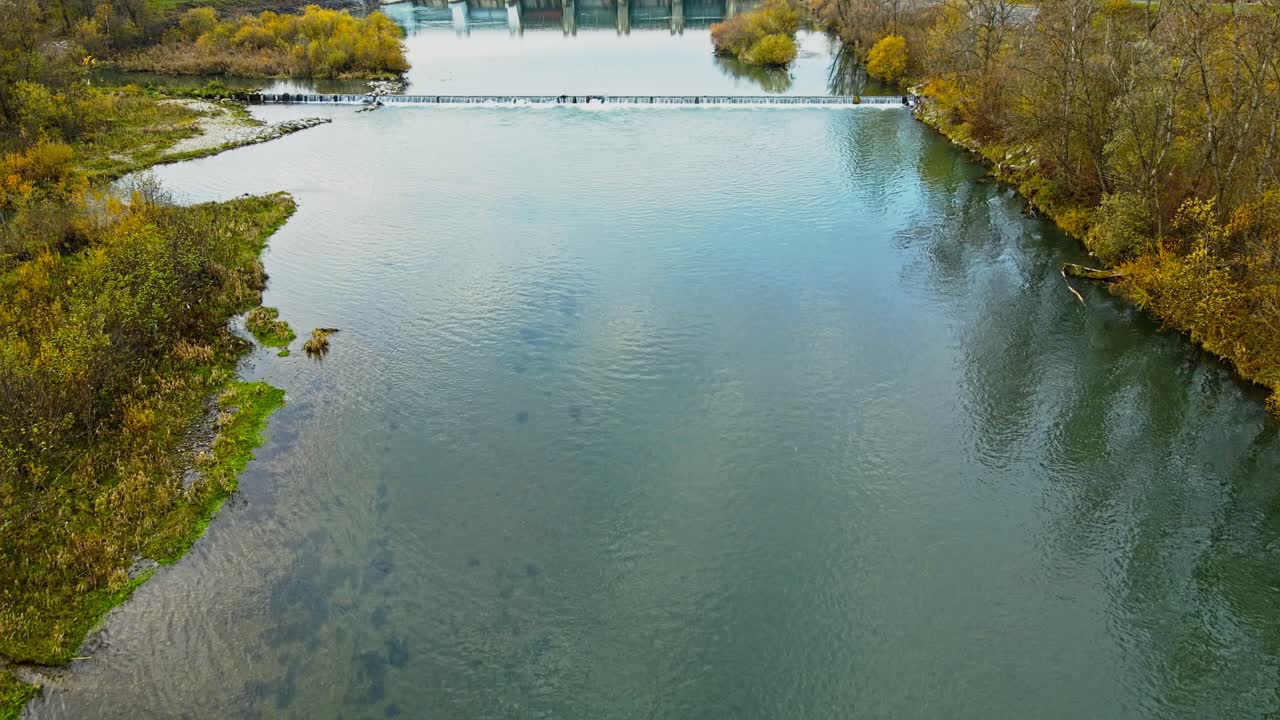 Aerial 4K drone footage of a Ptuj Lake and small Hydro Power Plant that has been constructed on the Markovci Dam and Drava river