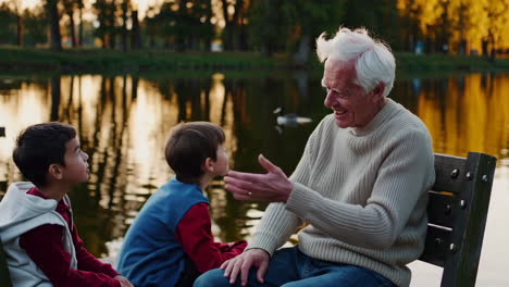 grandfather and grandchildren enjoying time together at the park