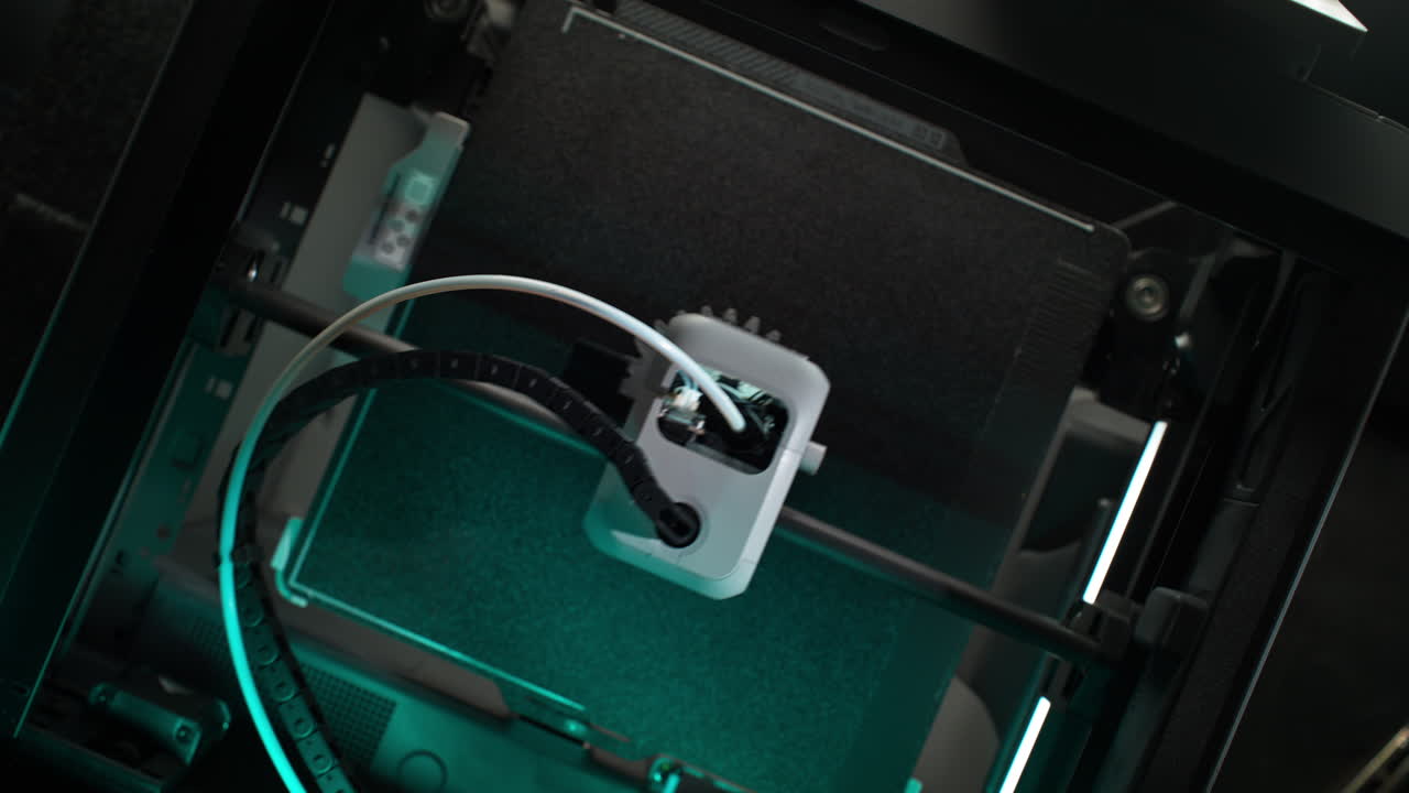 FDM 3D Printer Printing a Gear with Grey Thermoplastic Filament - Mechanism and Process Seen from Above