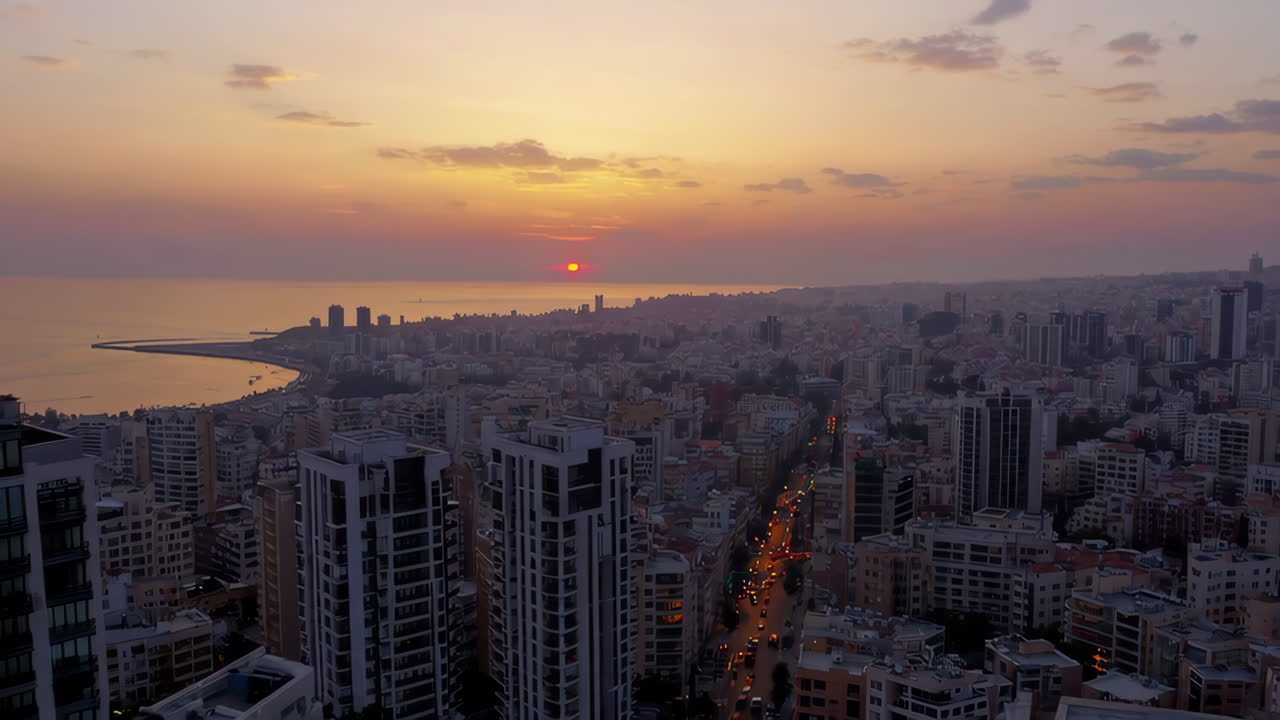 Aerial View of Beirut City at Sunset with Coastline and Urban Skyline