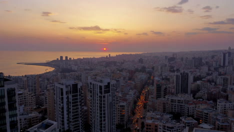 aerial view of beirut city at sunset with coastline and urban skyline