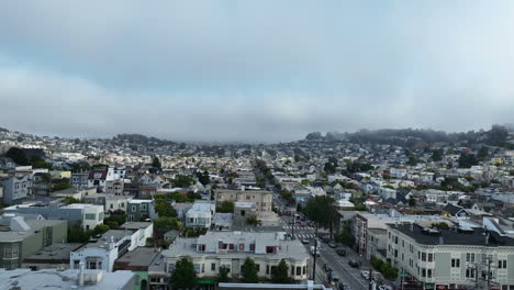 drone rising low over houses in the suburbs of san francisco, misty morning in usa
