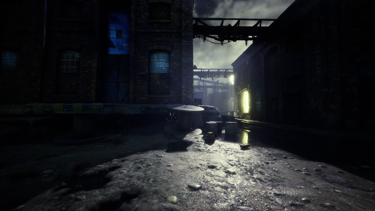 Abandoned industrial area with dim lighting and puddles at night