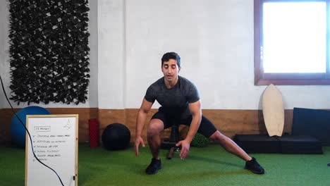 leg warm-up exercises with trainer during online class