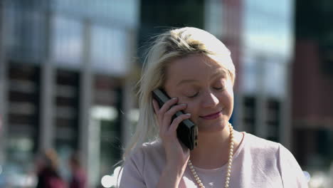 business woman enjoying the sun outdoor during making a phone call,slowmo