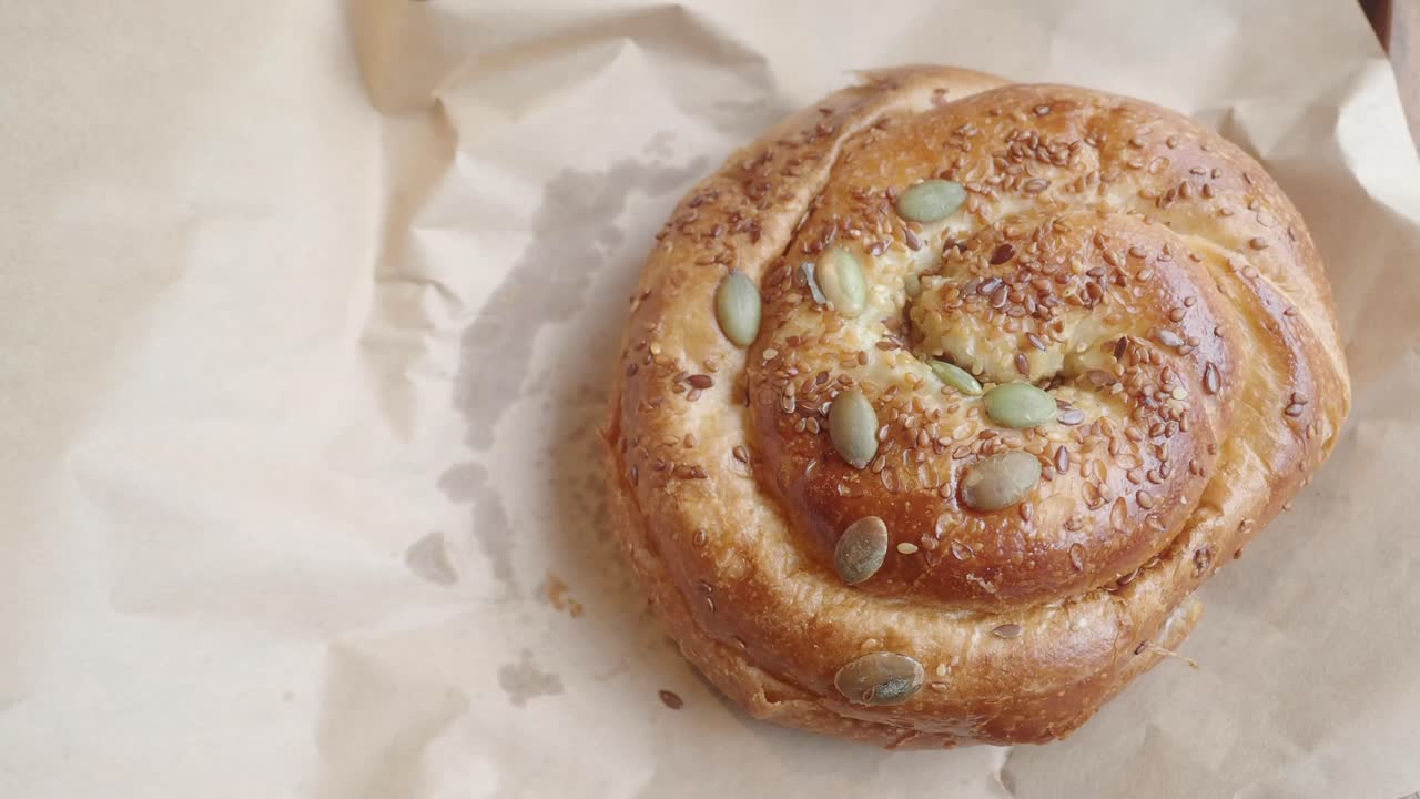 A close-up of a seeded pastry