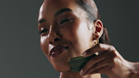 woman receiving gua sha facial massage