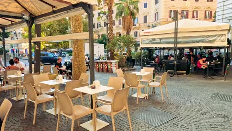 outdoor dining scene with people and traffic