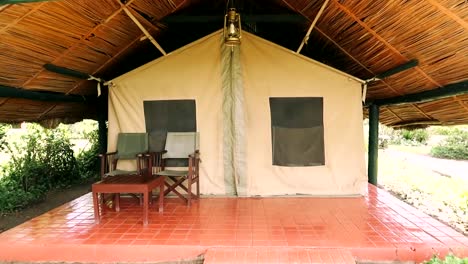 Walking-shot-up-to-a-tented-camp-protected-from-the-weather