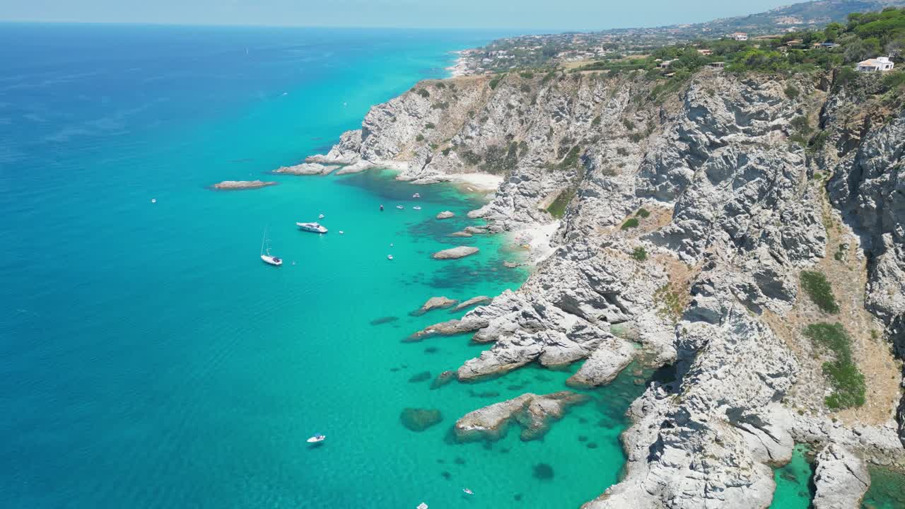 Capo Vaticano Cliff, Sandy Beaches, Blue Mediterranean Sea and Coastline of Calabria, South Italy - Aerial 4k Tilting Down