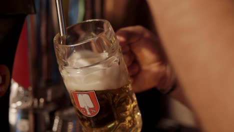 pouring beer into a glass