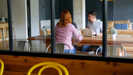 executives talking to each other in office cafeteria 4k