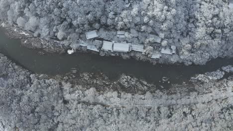 Japan-Winter-Scene,-Aerial-View-of-Katsura-River-and-Arashiyama-in-Snow