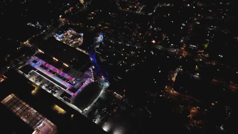 nighttime tilt-down drone shot over a southern mexico city neighborhood