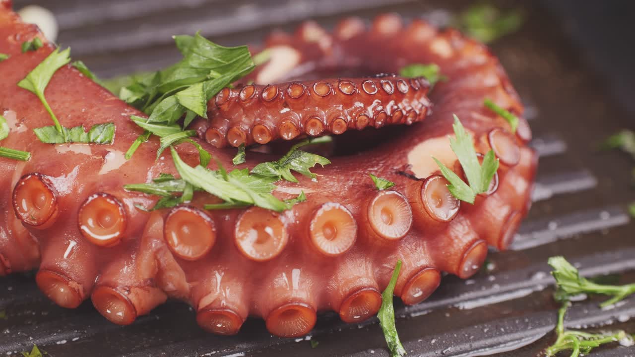 Octopus cooking, chef grill fresh octopus galician style on restaurant kitchen, healthy food, seafood cafe in spain, traditional asian japanese spanish and mediterranean dish.