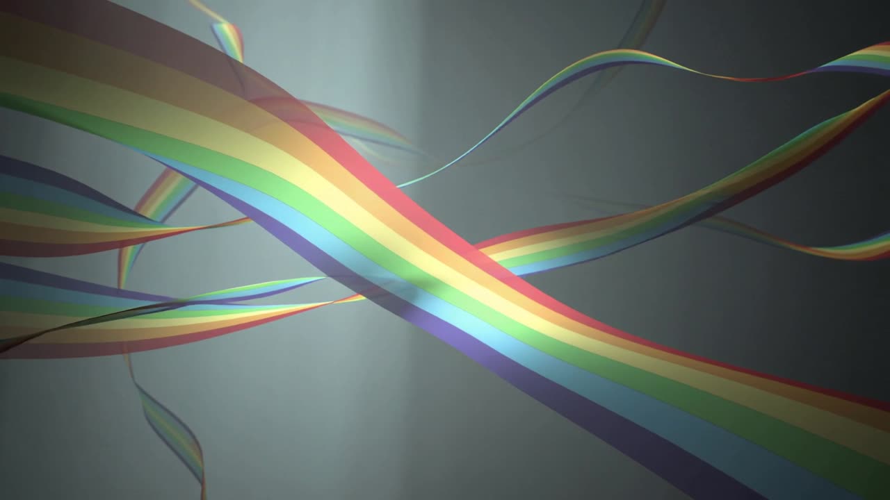 Nastri arcobaleno che entrano in diagonale intrecciandosi su uno sfondo grigio con una luce centrale che forma una trama