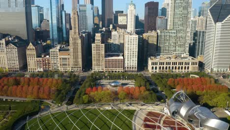 aerial establishing shot above millennium park, the bean in downtown chicago