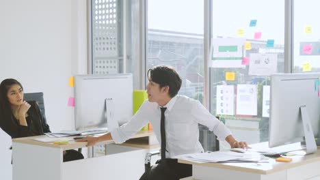 crazy happy businessman dancing in corporate.handsome young businessman doing victory dance about successful achievement and throwing paper documents. happy male at modern office