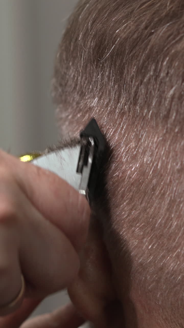 Close-Up of Hair Clipper Trimming a Man's Hair