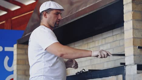 chef cooking outdoor. portrait of chef preparing food in restaurant