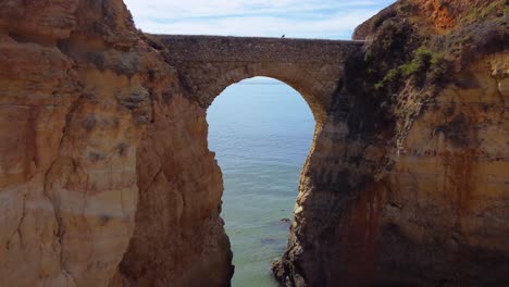 flying close to a roman bridge at algarve portugal