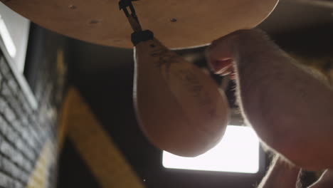 fists of boxer hit punch bag