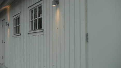 Man-enters-garage,-exterior-shot