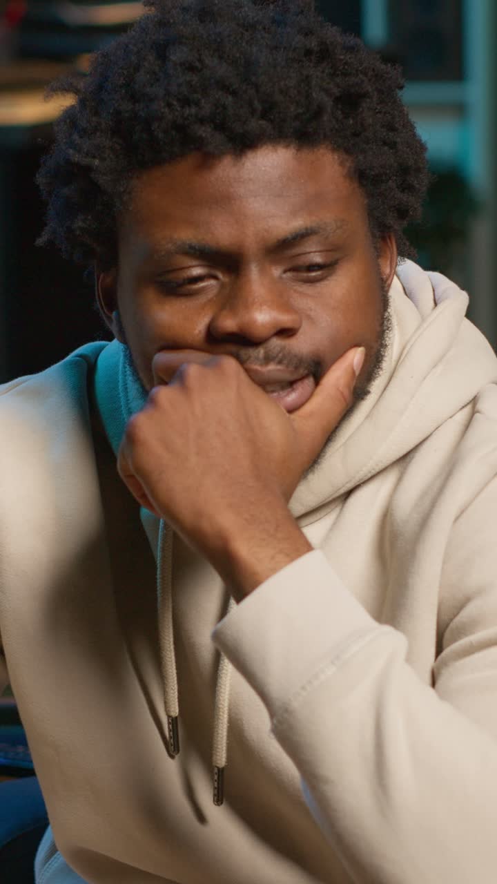 Young African American Man Looking Thoughtful and Pensive