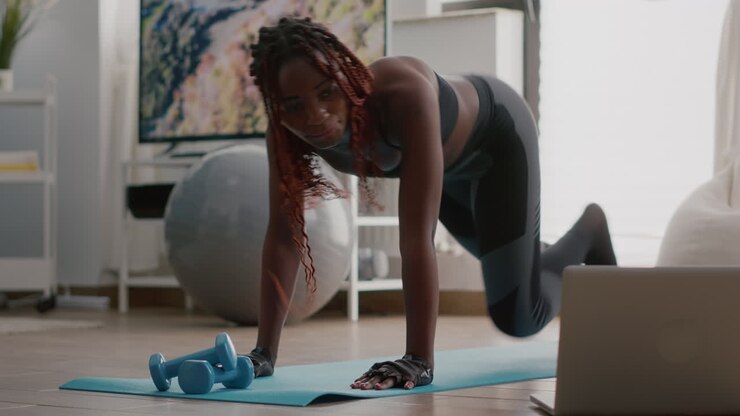 Fit black woman in sportswear doing workout burning fat calories