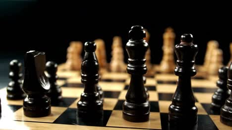 Chess-set-against-black-background