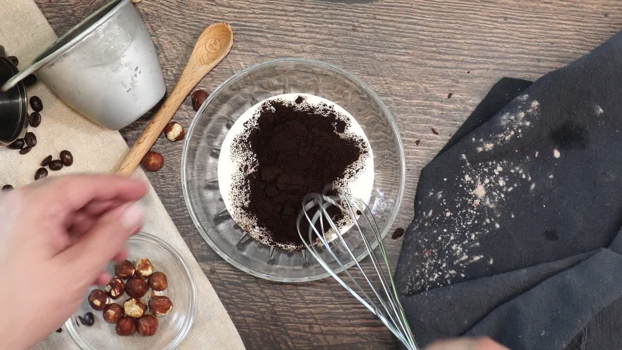 A delicious dessert, Coffee Hazelnut Cream Tart. Made with espresso powder, chocolate crust and loaded with crushed hazelnut. Hand whisking espresso powder and milk or cream together in a mixing bowl