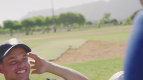 baseball player doing sit ups at a playing field