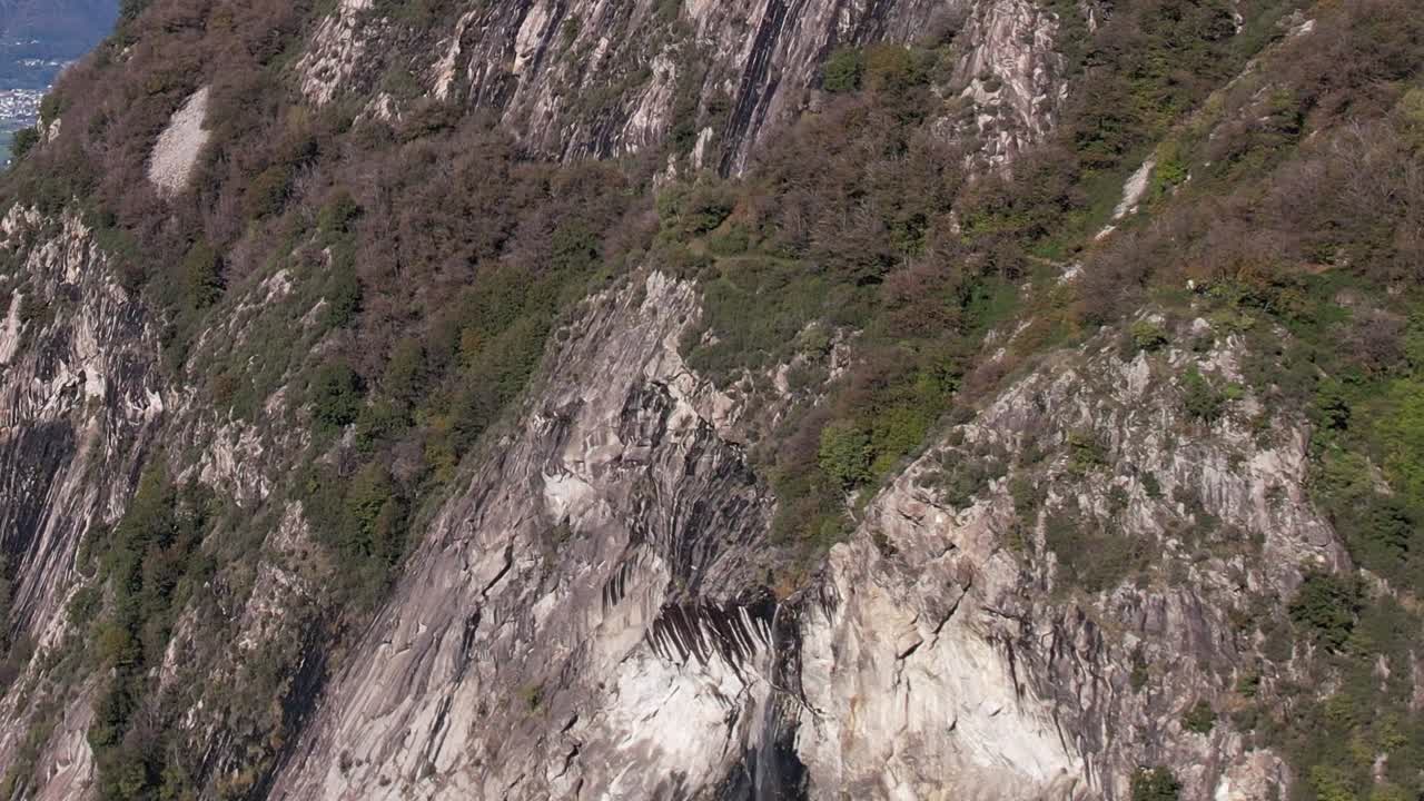Stunning aerial view of the Italian Alps with cliffs and greenery