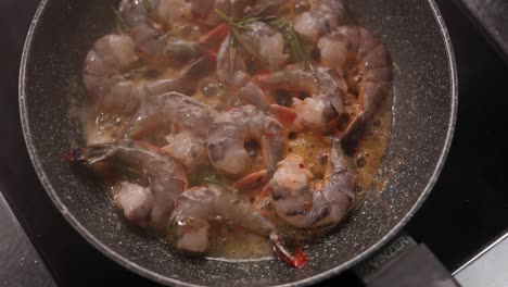 cooking shrimp in a pan