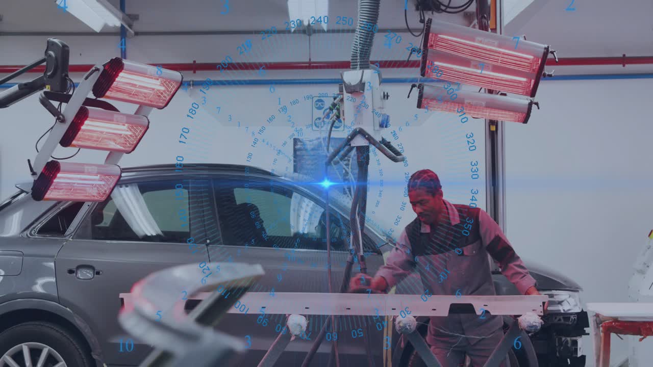 Male tech inspecting panel in auto body shop, scanner emitting blue light ensuring panel alignment