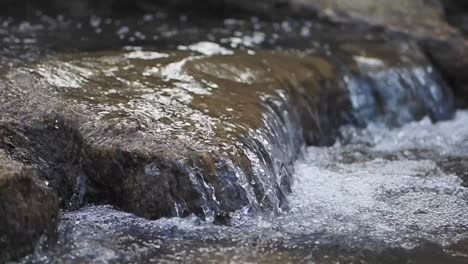 close-up of a small waterfall in a stream