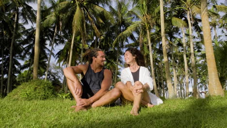 Young-couple-sitting-on-the-grass