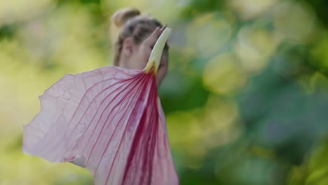 pink flower petal and woman with fabric