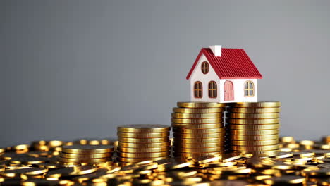 house on top of stacks of coins