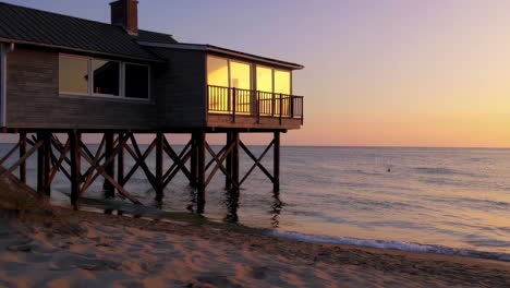 sunrise over coastal beach house