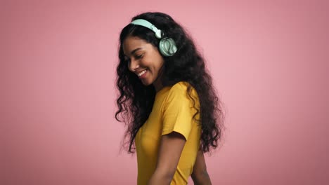 video of african young woman listening to music and dances