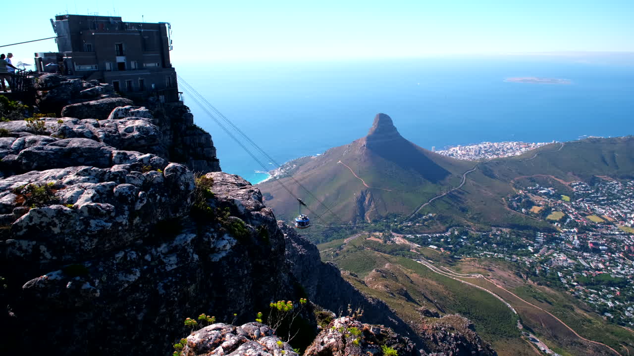 Table Mountain cable car on aerial cableway arrives at upper station
