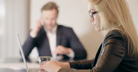 Businesswoman-In-Office-With-Laptop-Computer