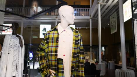 mannequin in plaid jacket at museum exhibit